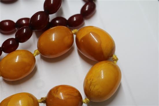 An amber bead necklace and a simulated cherry amber necklace.